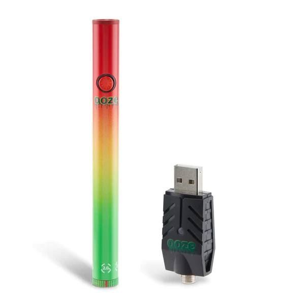 Rasta Ooze Slim Twist Pen 2.0 with usb charger next to it